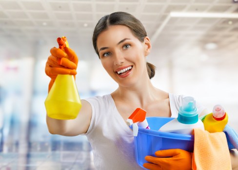 Carpet cleaning technician preparing equipment with safety checks