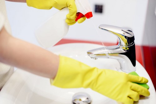 Technician applying a safe cleaning method on a carpeted floor