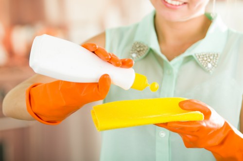 Professional carpet cleaner handling a service issue